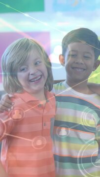 Vertical video: Two boys posing for class pic friend coming and draping arm sparking network icons