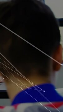 Vertical video: Cam panning, plaid teen turning while peers responding to cue, school nodes linking