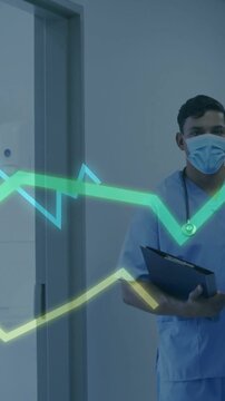 Vertical video: Clinician holding folder by door, charts moving from left showing vitals over him