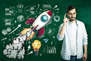 Rocket startup concept with illustrated spaceship launch, business growth icons and a person pointing on a chalkboard background for success ideas.. © Who is Danny