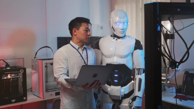 Engineer meticulously tests and calibrates artificial intelligence components in laboratory environment