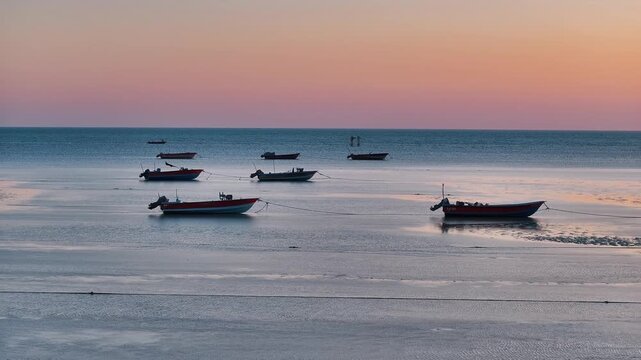 a dreamy sunset at a boat dock in southern Iran 