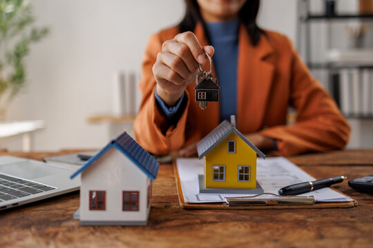 Real estate contract sign. Property mortgage finance signing agreement approved, mortgage contracts key.
