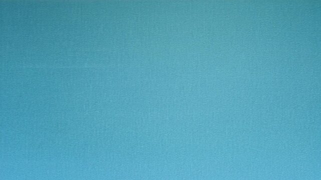 A full-frame analog TV interference overlay with soft moving noise. Fine grain static slowly shifts across the screen, combined with subtle horizontal scanlines and occasional rolling distortion bars.