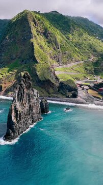 Atlantic Ocean coastline of Madeira Island featuring large sea stacks and rugged coastal rock formations
