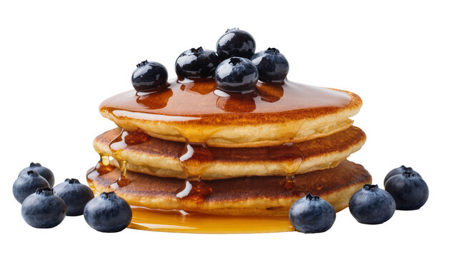 Isolated delicious fluffy pancakes topped with juicy blueberries and golden syrup drizzled.