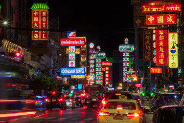 Stunning light trails of traffic at night in Yaowarat Road, Chinatown, Bangkok, Thailand © julen