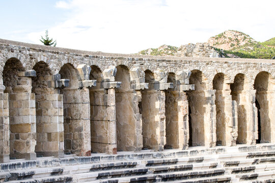 Historic ruins of an ancient city with majestic stone archways under a clear sky