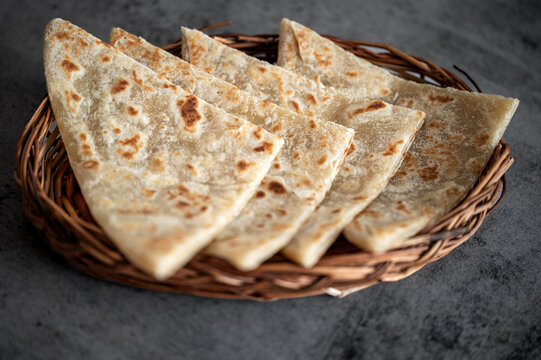 Traditional Indian vag and chicken curry served with naan flat bread. Indian curry, chicken tikka masala with rice and naan bread. Dark background. Copy space.