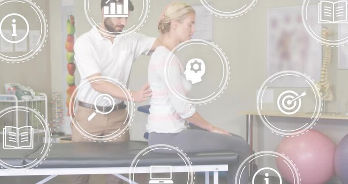 Patient starting physical therapy on padded table as therapist guiding spine flexion for mobility