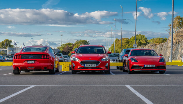 Gothenburg, Sweden - september 06 2022: Red sports and passenger cars parked outdoors.