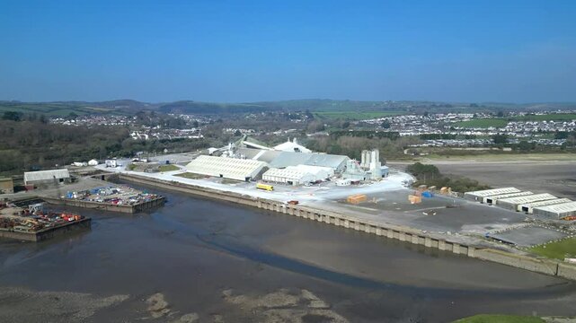 Par, Cornwall, England: DRONE VIEWS: Par Docks with the town of Par and Par Sands beach in the b/g. The Docks is a milling centre and also receives a slurry form of china clay for transporting.