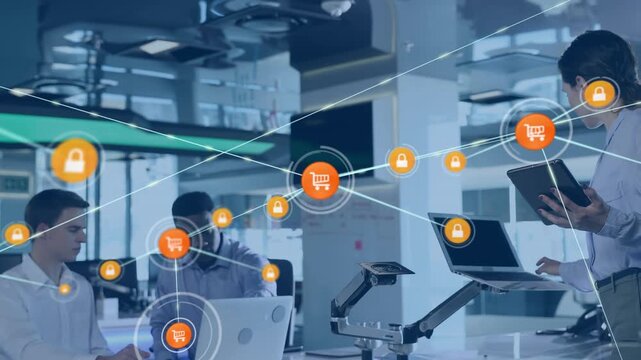 Animation of network of connections with icons over diverse business people using tablet and laptop