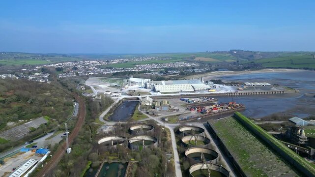 Par, Cornwall, England: DRONE VIEWS: Par Docks with the town of Par and Par Sands beach in the b/g. The Docks is a milling centre and also receives a slurry form of china clay for transporting.