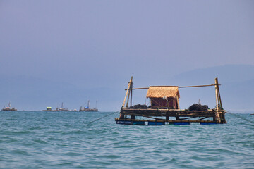 Floating Fishing Hut On Calm Ocean Water © Silmiart