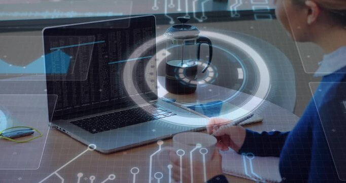 Software engineer grabbing coffee mug then writing code and causing hologram pulsing around press