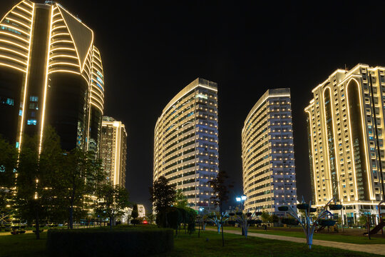 View of flower park in front of modern skyscrapers of Grozny City