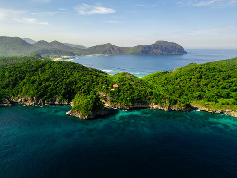 Lawar Beach with White Sand and Rugged Cliffs in West Sumbawa Indonesia