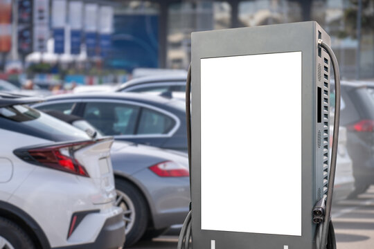 Electric vehicle charging station with large digital advertising screen