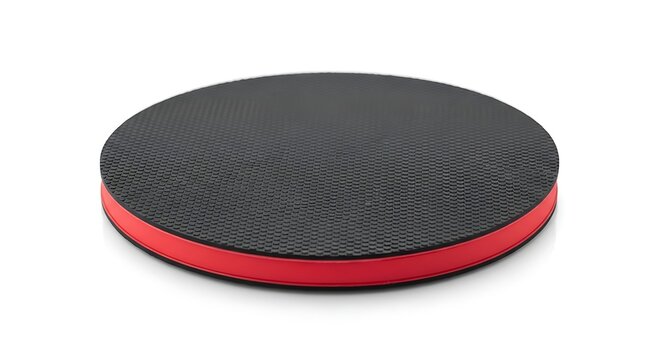 A black textured balance board with a vibrant red rim is presented from a slight angle on a bright white background.