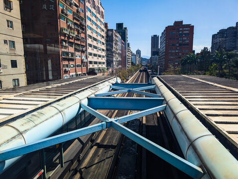 Elevated perspective of Xihu MRT Station, showcasing the sleek structure and bustling atmosphere of Taipei's metro system. 15-03-2026