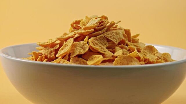 Cornflakes in a white cup.	