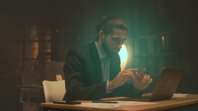 Dedicated lawyer reviewing case materials thoroughly under ambient lighting for legal accuracy and precision