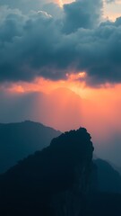 Fototapeta premium Dramatic Mountain Landscape at Sunset with Clouds.