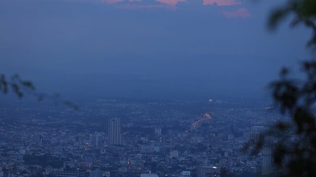 The video background features an aerial view from Khao Kho Hong, Hat Yai, showing the dense residential area of ​​Hat Yai city amidst the lights and fog that varies with the season.
