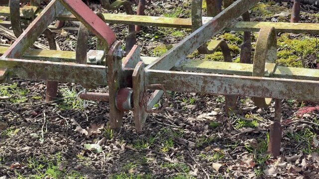 Rusty metal agricultural plow implement close up