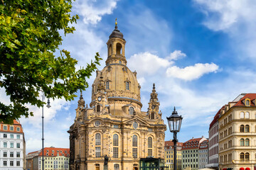 Fototapeta premium Frauenkirche with baroque dome at Neumarkt in Dresden under bright sky.