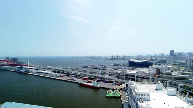 Kobe Japan Bay Area Port Island and Ocean View Aerial. Sunny Day Panning Drone Shot. 4K.