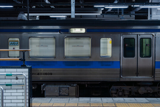 May 26, 2024, Shimonoseki, Japan - Side view of a train at a station platform