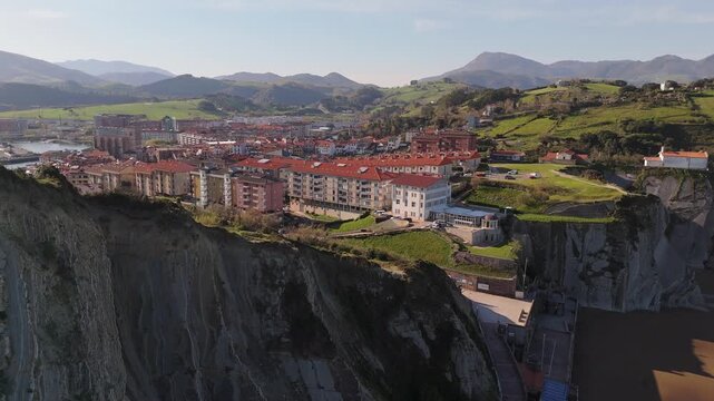 Aerial view of Itzurun Beach cliffs and coastal town in Zumaia