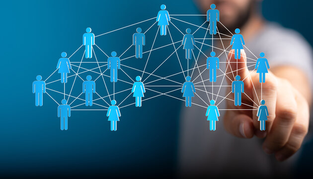 Concept of teamwork connection and networking symbolized by a human hand interacting with digital representation of peo