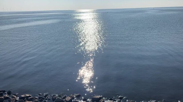 calm sea with the sun reflected