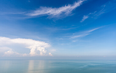 Fototapeta premium View of blue sky and ocean with white cloud