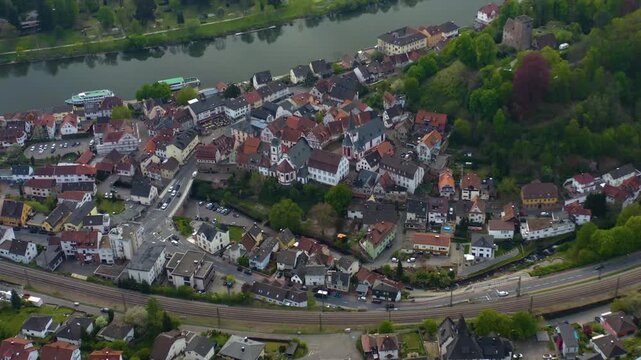 Aerial view of the city and castle Neckarsteinach in Germany beside the river neckar. On a sunny spring day