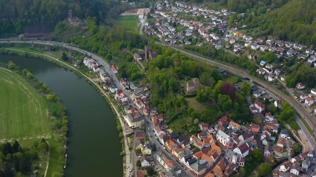 Aerial view of the city and castle Neckarsteinach in Germany beside the river neckar. On a sunny spring day
