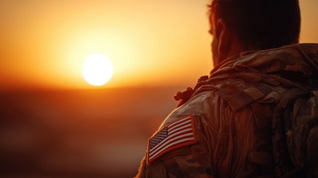 Soldier Silhouette with Flag Patch at Sunset Horizon