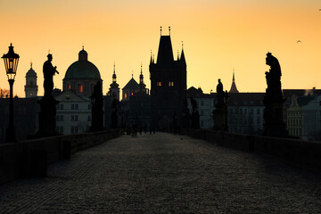 Fototapeta premium charles Bridge in Prague Czech Republic at sunrise with historic statues