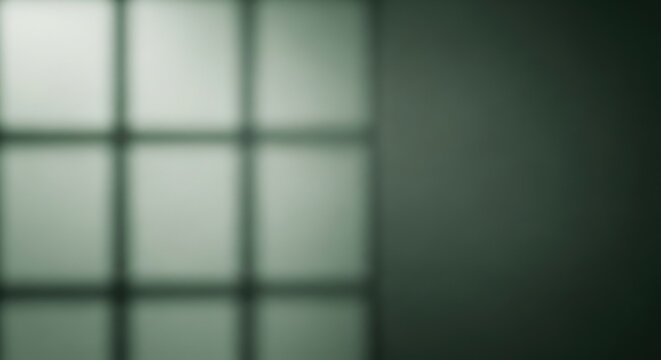 Blurry window pane background with dark and light green tones