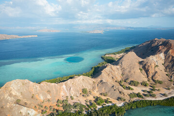 Aerial view of Pulau Siaba Besar island on a sunny tropical day © Hector