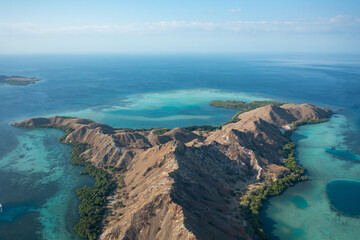 Aerial view of Pulau Siaba Besar island on a sunny tropical day © Hector