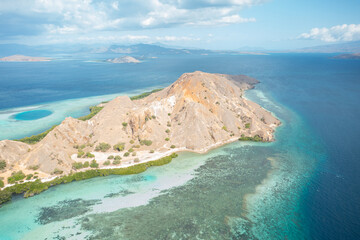 Aerial view of Pulau Siaba Besar island on a sunny tropical day © Hector