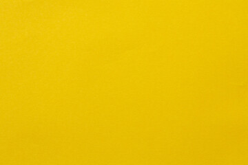 Fototapeta premium Bright yellow solid color background with smooth gradient for creative design
