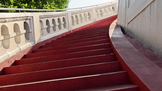Golden Mount Curved Staircase Leading Up Temple Path with White Railing