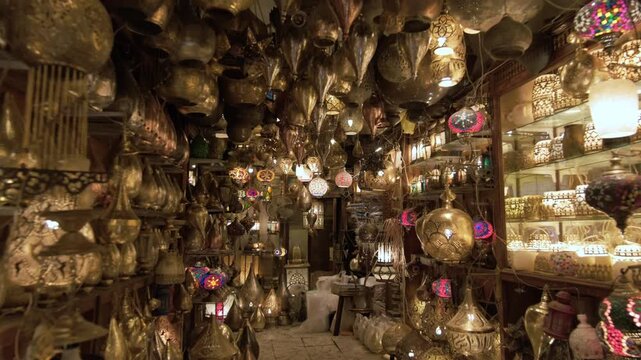 Shop with vintage copper lamps with various patterned shades in oriental bazaar, Khan El Khalili market in Cairo Egypt