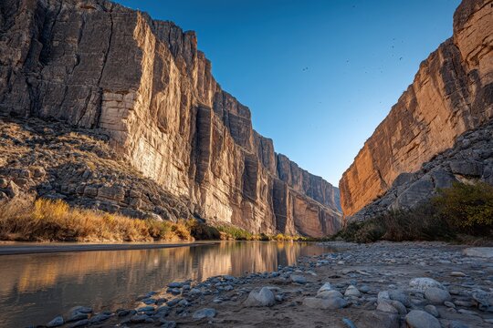 Desert twilight over Santa Elena Canyon: dramatic cliffs, calm river, and vast sky in the Southwest