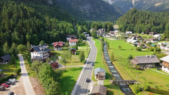 Aerial drone view following car towards Gosaukamm mountains, Austria